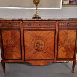 A high quality 19th Century French marquetry inlaid Kingwood marble top credenza. It has an attractive solid marble top and decorative marquetry inlay throughout. It has plenty of storage space with three drawers and three doors. It has been sourced from France and is in good original detailed condition.