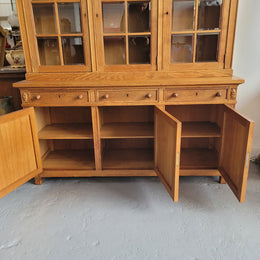 Edwardian Oak dwarf bookcase with six cupboards and three drawers. In very good original detailed condition.
