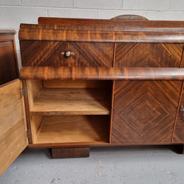 Vintage Walnut Art Deco “Waterfall” sideboard buffet with two drawers and two doors. It is in good original condition and has been sourced locally.