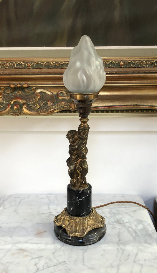 Vintage Brass cherub lamp with a marble and brass base and lovely frosted flame glass shade in good condition.