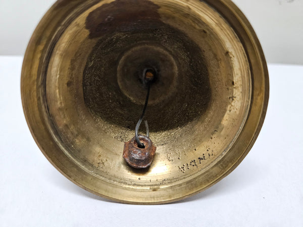 Vintage brass bell with engraved lines and markings on the insde. Please see photos as they form part of the description. In good original condition.