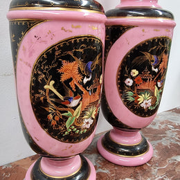 Late Victorian pink and hand painted, enameled pair of vases with some ware to enameling. It is in good original condition.