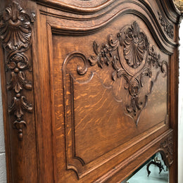 Antique French Oak Louis XV style mantle/trumeau mirror. It has its original mirror and is in good original detailed condition.
