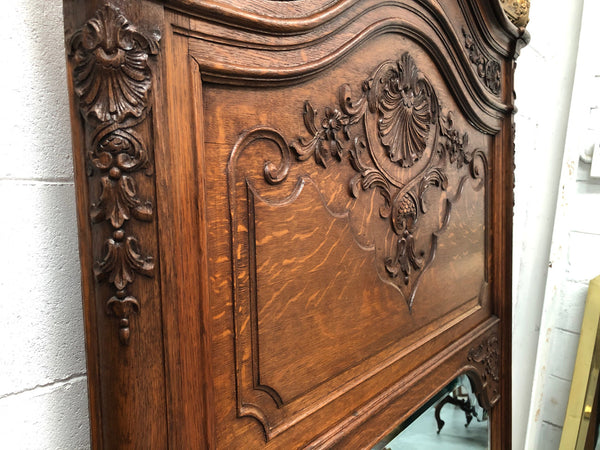 Antique French Oak Louis XV style mantle/trumeau mirror. It has its original mirror and is in good original detailed condition.