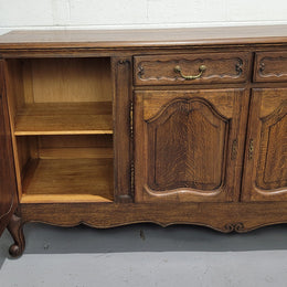 Late 19th Century French carved Oak Louis XV style four drawer sideboard. Plenty of storage space with four cupboards and two drawers. It is in good original detailed condition with all locks functioning with keys.