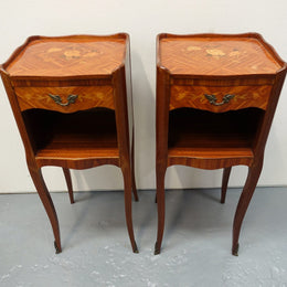 A pair of circa 1950 French marquetry inlaid Kingwood bedside cabinets, in the Louis XV style. In very good original condition.
