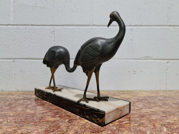 Fabulous French Art Deco cold painted spelter Ibis birds on a stylized Art Deco marble base. Signed "Rochard" circa 1930's. In good original detailed condition.