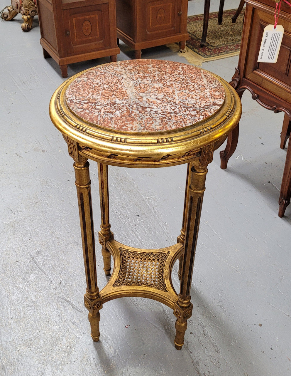 Late 19th Century French Louis XVI style round marble top side table/ lamp table. It is in good original detailed condition and has been sourced from France.