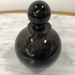 Nick Wirdnam round with one edge flat black art glass scent bottle. Signed underneath In good original condition.