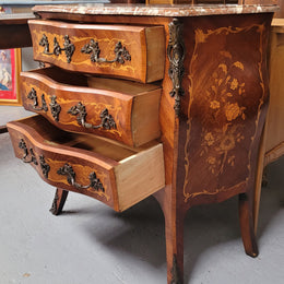 Antique French Louis XV style compact three drawer marble top commode with marquetry inlay and ormolu mounts. Sourced from France and in good original detailed condition.
