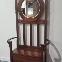 Blackwood Federation hall stand of pleasing narrow proportions. Beautiful round mirror with four lovely hooks and a lift up sit for added storage. In good original condition.