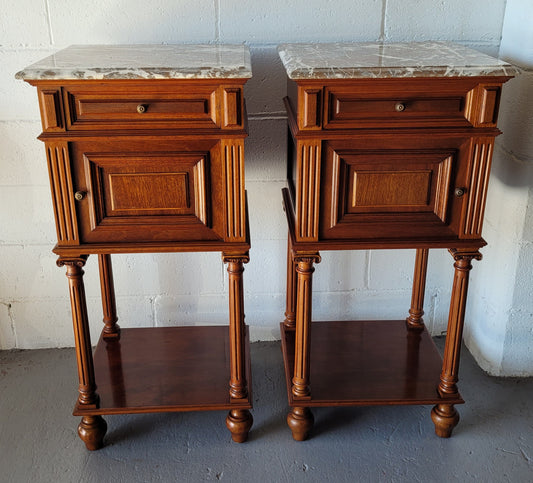 Pair of Henry II style Walnut bedside cabinets with a marble top. Circa 1920s and in good original condition.