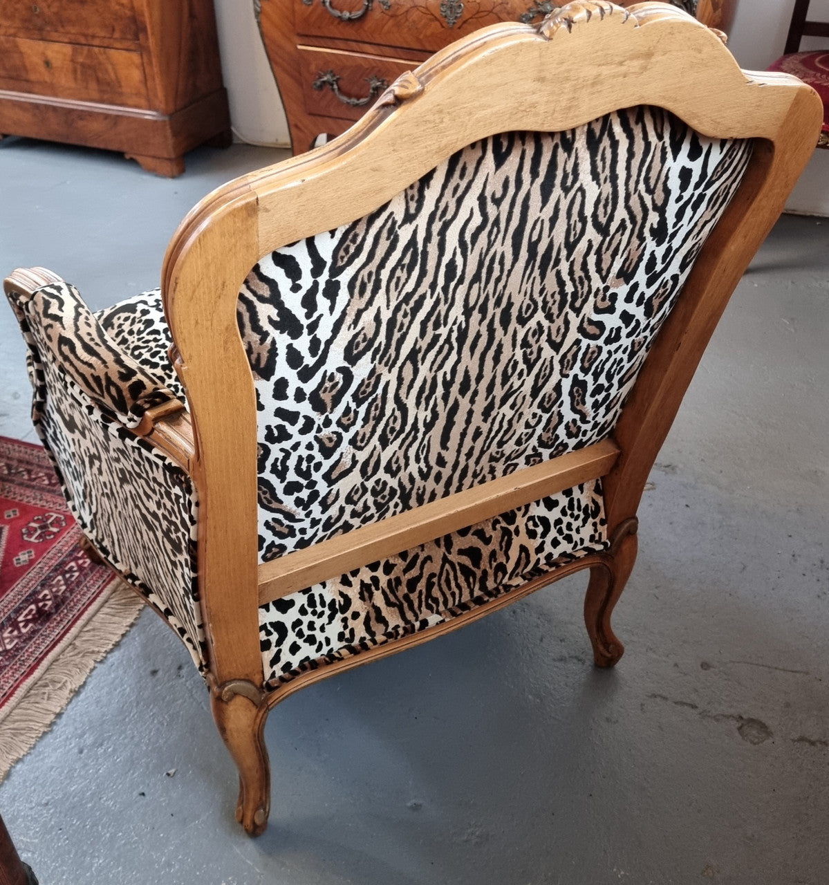 A French Louis XV style Armchair With Leopard Print Upholstery With Matched Footstool