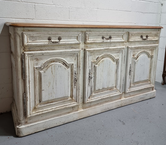 19th Century French painted three door oak buffet. Plenty of storage space with three drawers and doors. In good original condition.