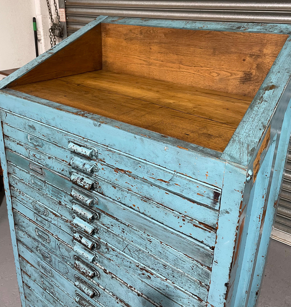 Fabulous set of vintage painted blue printers drawers that have adjustable separators which can be taken out for large papers. The drawers are various sizes and there is a section on top for working on or for storing brushes or tall items . These would be perfect for artists or jewellery pieces or even architects. Such a beautiful piece of industrial furniture.