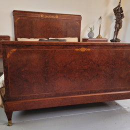 French Art Deco bedroom suite consisting of queen size bed in Amboyna wood and featuring pretty inlay. It comes with a matching pair of bedsides. It is a very stylish and high quality suite. It has been sourced from France and is in good original detailed condition.
