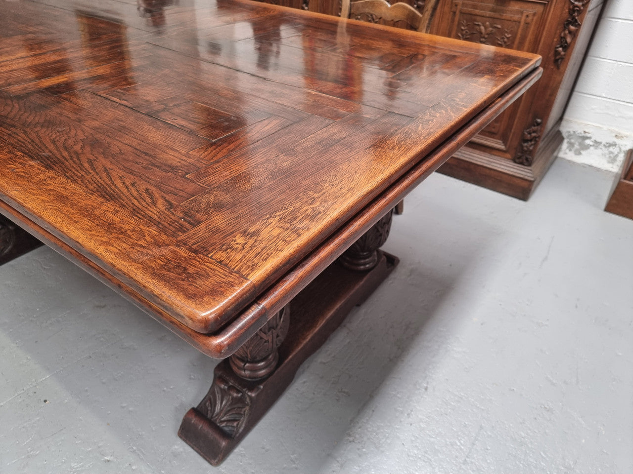 Renaissance style Oak extension table with parquetry top and twin pedestal base. The table extends by pulling out an extension leaf either side making it 287 cm long. Sourced from France and in good original detailed condition.