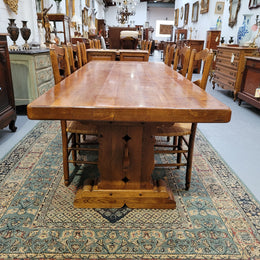 French Farmhouse table with a beautiful thick plank top and stretcher base. Can seat 8-10 people comfortably and is in good original detailed condition.