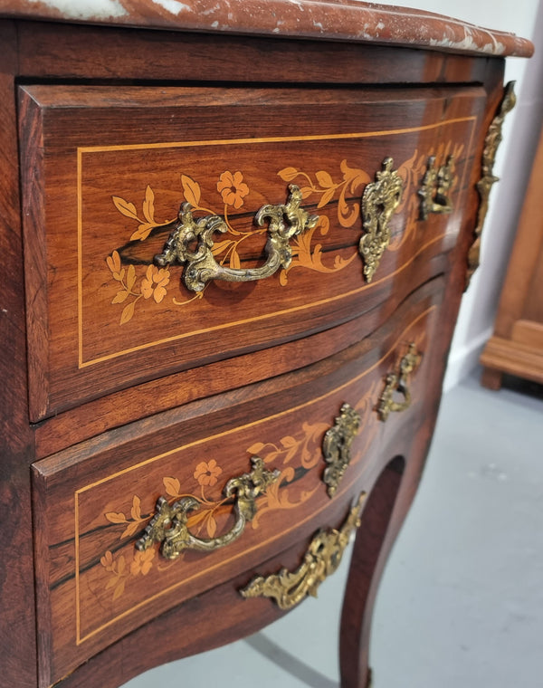 A stunning French petite two drawer inlaid Rosewood commode. In good original detailed condition.