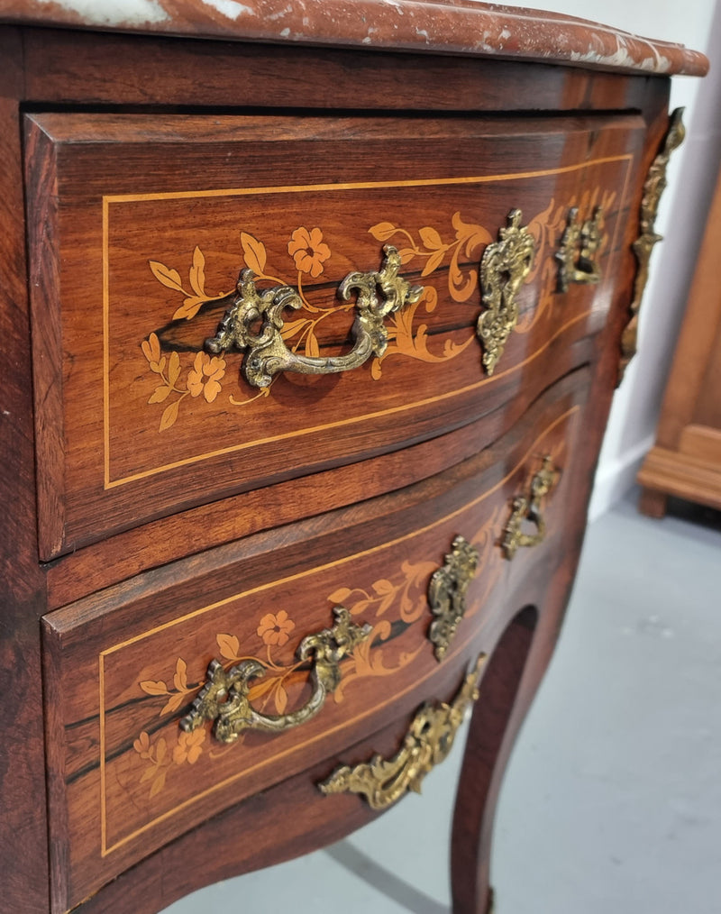 A stunning French petite two drawer inlaid Rosewood commode. In good original detailed condition.