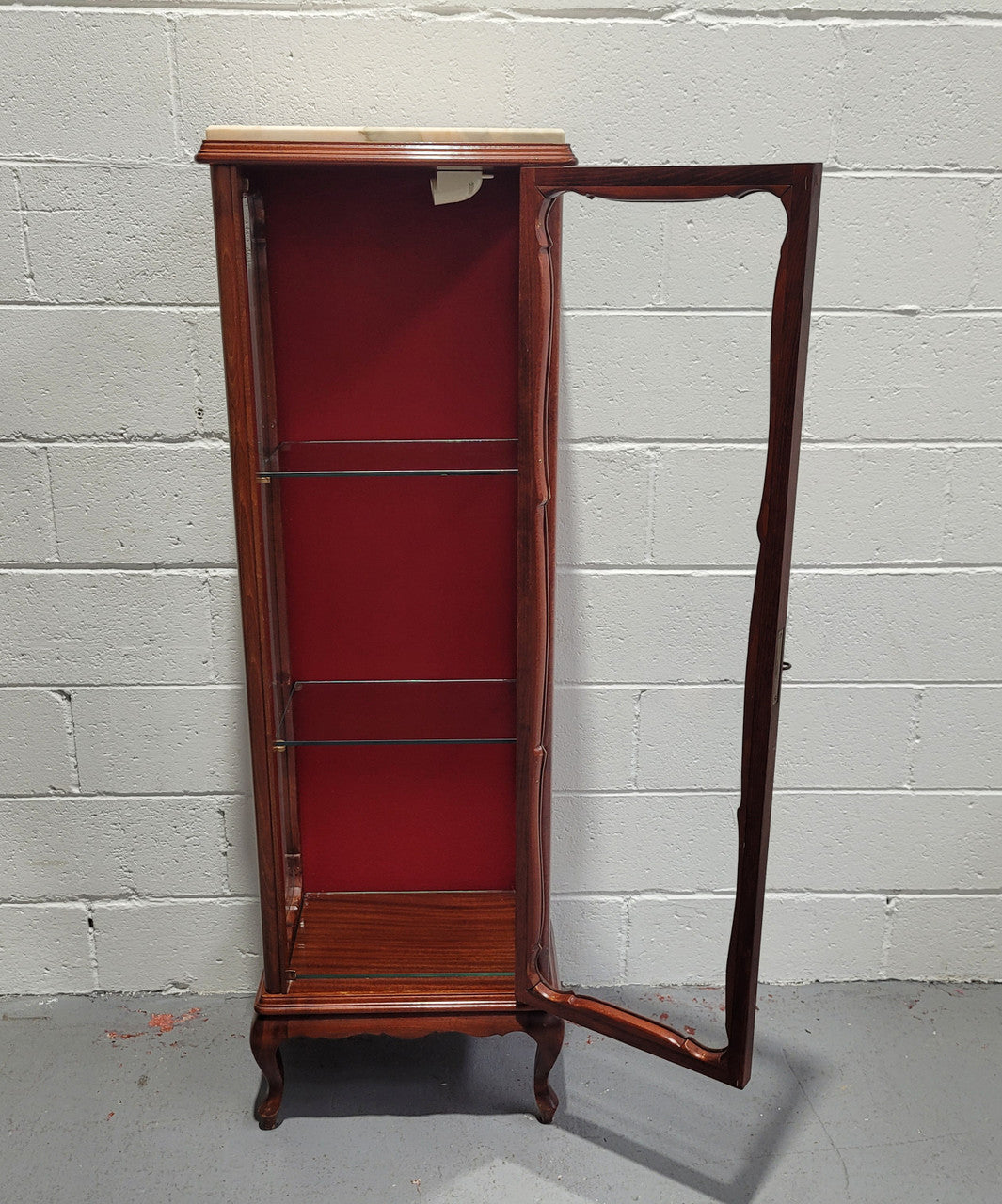 French Louis XV style compact display cabinet with marble top. It is of pleasing proportions with a lovely maroon fabric back and two glass shelves. In good original detailed condition.