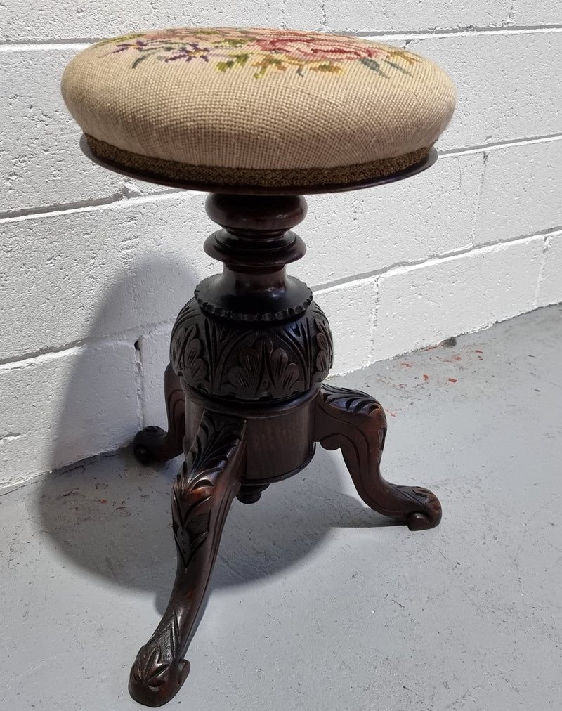 Beautiful Late Victorian Floral tapestry covered revolving piano stool. It is in very good original detailed condition. It has a original David Jones label underneath .