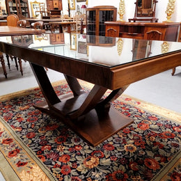 French Art Deco Figured Walnut dining table and six chairs. This stylish table also comes with a glass top and can be used with or without it. The chairs are very comfortable and the table can also fit another two chairs at either end making it a 6-8 seater. The table is in good original detailed condition with character marks to the top of table as shown in the pictures. This table and six chairs have been sourced locally.