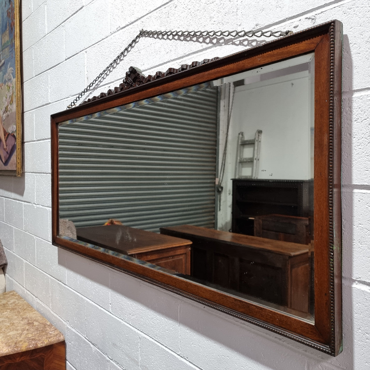 Attractive Edwardian rectangular wall mirror, with carved detail and beaded edge. Retaining it's original bevelled edge mirror and is in good original condition.