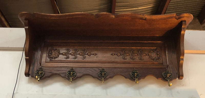 Beautiful French carved coat/hat rack with five decorative brass hooks and lovely detail in good condition.