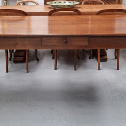 Antique French Oak Farmhouse table in fully restored condition. Features a single drawer and tapered legs.