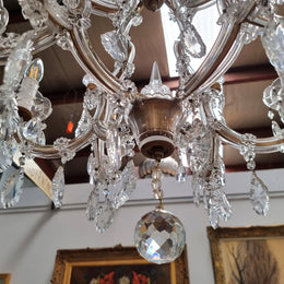 Sourced From France an attractive eight arm French crystal chandelier. It has been fully rewired to Australian standards and is in good original working condition.