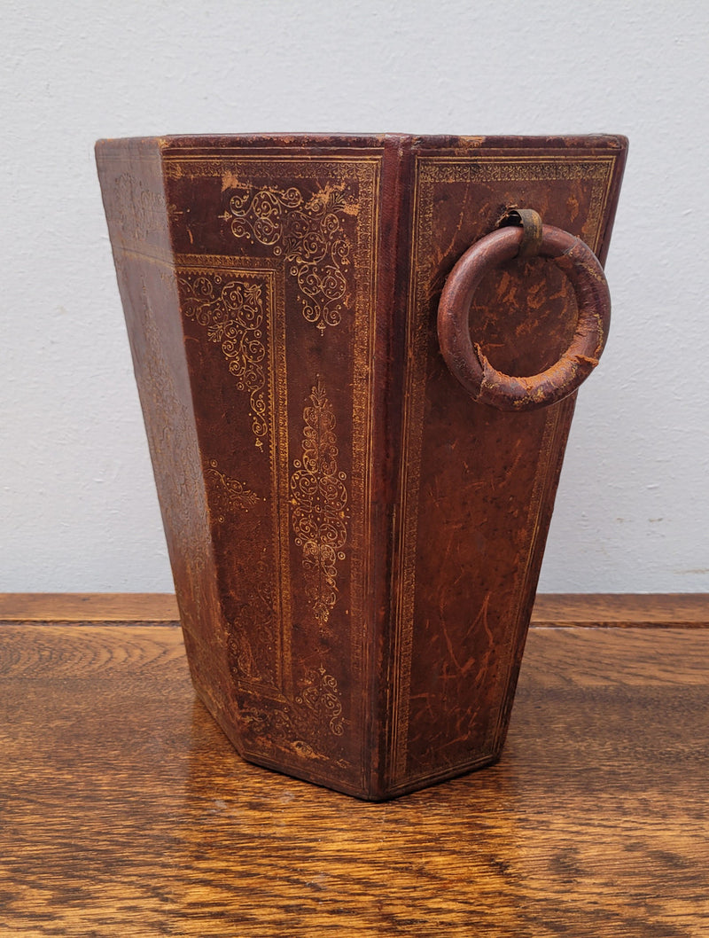 Vintage Italian tooled leather waste bin. It has been sourced locally and is in good original detailed condition. Please view photos as they help form part of the description.