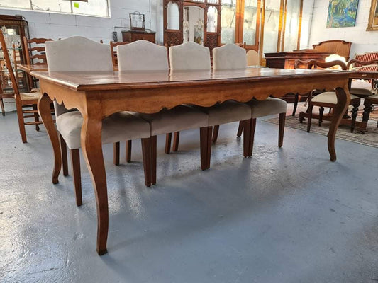 An amazing Vintage Cherry Wood dining table. Comfortably seats eight people and is in good original detailed condition.