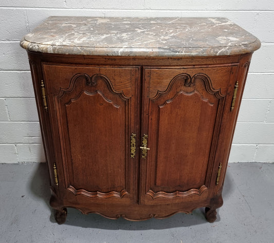 Rare 19th Century French Oak and marble top oval buffet / cabinet. Stunning thick marble top and decorative handles. In good original detailed condition.