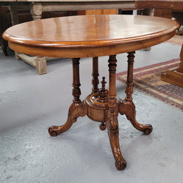 Victorian Walnut oval beautifully inlaid occasional table with bird cage undercarriage. It is in good original detailed condition and it has been sourced locally.