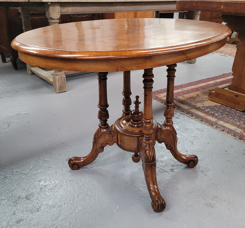 Victorian Walnut oval beautifully inlaid occasional table with bird cage undercarriage. It is in good original detailed condition and it has been sourced locally.