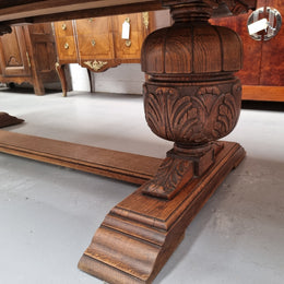 French Oak Renaissance style extension table with a stretcher base and heavily carved bulbous. When the table fully extends it measures 300 cm and can be used with both sides out or with only the one leaf out either side. It is in good original detailed condition.