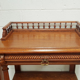 A French 19th century oak carved three tier cabinet. The cabinet/dumbwaiter has carved half border top that can be removed. Drawer for storage and in very good original condition.