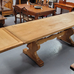 Stunning French Oak Farmhouse table with two extension leaves. When fully extended the table measures to a massive 339.5 cm long. Sourced from France and in good original detailed condition.