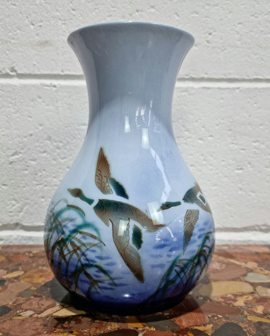 Lovely vintage vase by Falconware potteries, featuring ducks flying over reeds on a lake. It has some crazing, but no damage. Good condition, commensurate with the age, please view photos.