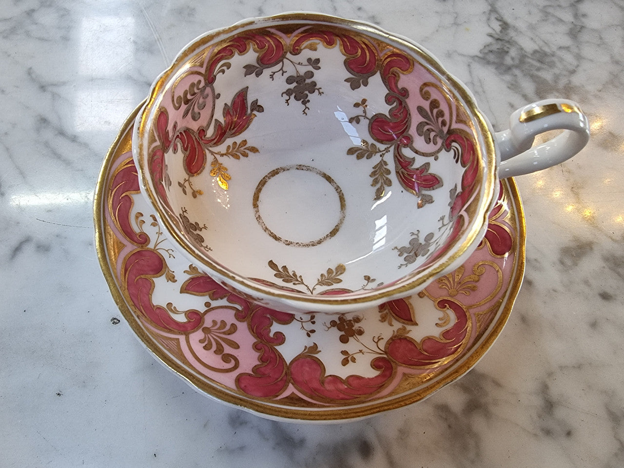 Early Victorian Cup and Saucer patterned in pink and gold tones. In original condition please view photo's as they form part of the description.