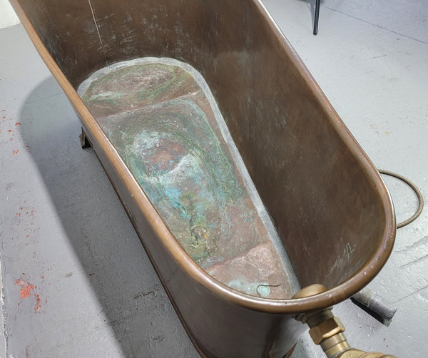 Sourced from France a rare full copper Antique bath tub on feet and includes an overflow, fittings, taps ect. In good original condition.