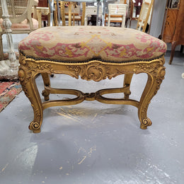 Charming 19th Century gilt wood tapestry covered Louis XV style stool. It has a beautifully carved base and undercarriage and it has been sourced from France. It is in good original detailed condition, please view photos of tapestry has they help form part of the description.