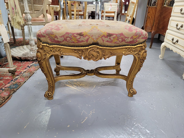 Charming 19th Century gilt wood tapestry covered Louis XV style stool. It has a beautifully carved base and undercarriage and it has been sourced from France. It is in good original detailed condition, please view photos of tapestry has they help form part of the description.