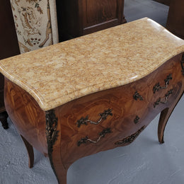 An elegant French Louis XV style kingwood two drawer commode with beautiful decorative inlay and ormolu mounts. Stunning coloured marble top and is in good original detailed condition.