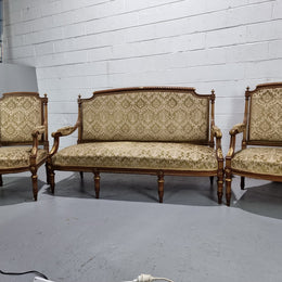 Beautiful French walnut Louis XVI style upholstered three piece Salon Suite. It has lovely fabric which is in overall good condition and is very comfortable to sit in. In good original detailed condition.