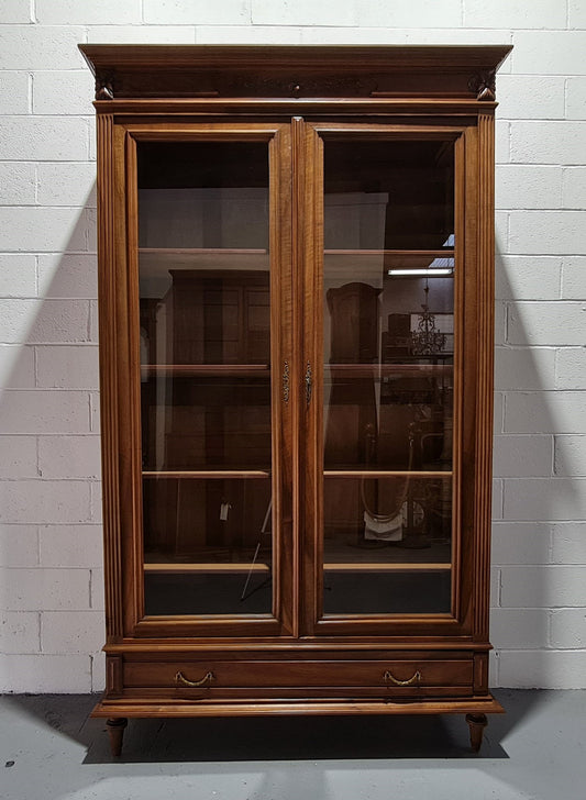 Stunning French Henry II style Walnut two door bookcase. In good original detailed condition.
