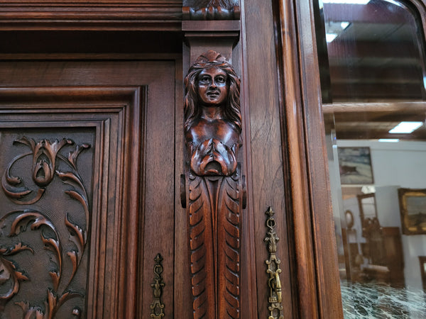 Spectacular French Walnut Renaissance Style buffet with amazing detailed carvings. Plenty of storage space with five cupboards and two large drawers. The three top cupboards open up to two adjustable shelves in each section and the two bottom drawers open up to one large fully adjustable shelve. In good original detailed condition.