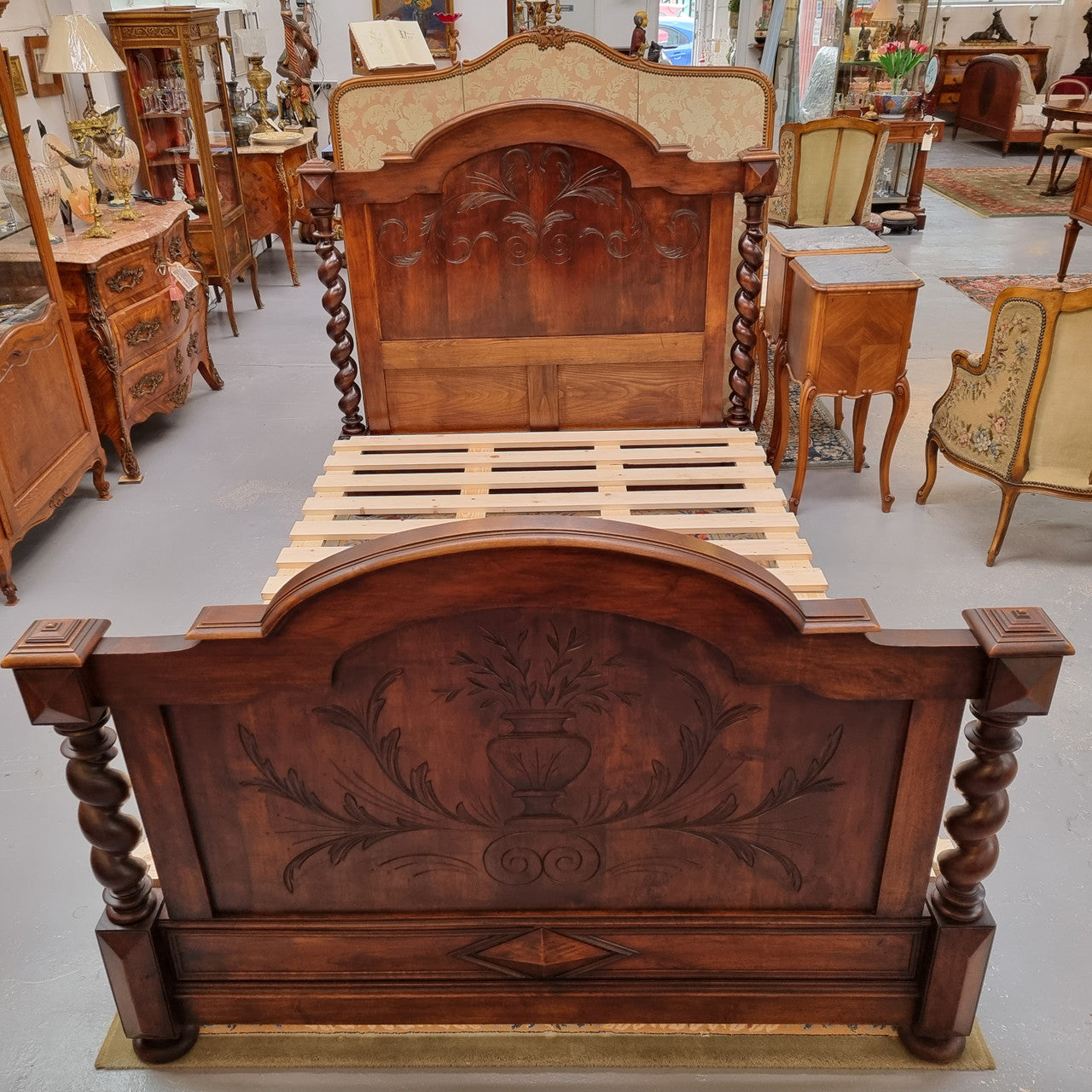 French 19th Century Walnut Henry II style queen sized bed with Barley Twist posts. Bed comes complete with custom made slats. Just place your mattress on top. In good original detailed condition.