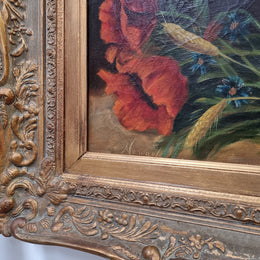 Lovely French signed floral oil on canvas of beautiful Poppies and Daisies in a ornate decorative frame. In good original condition.